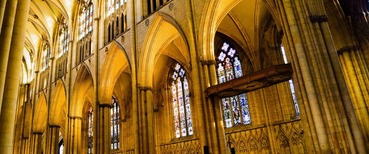 Close up of the detailing on the walls and stained glass of York Minster