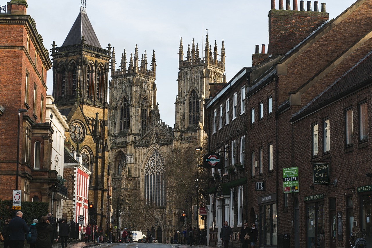 A photograph of literary York showing the old buildings, shops, and cobbled streets.